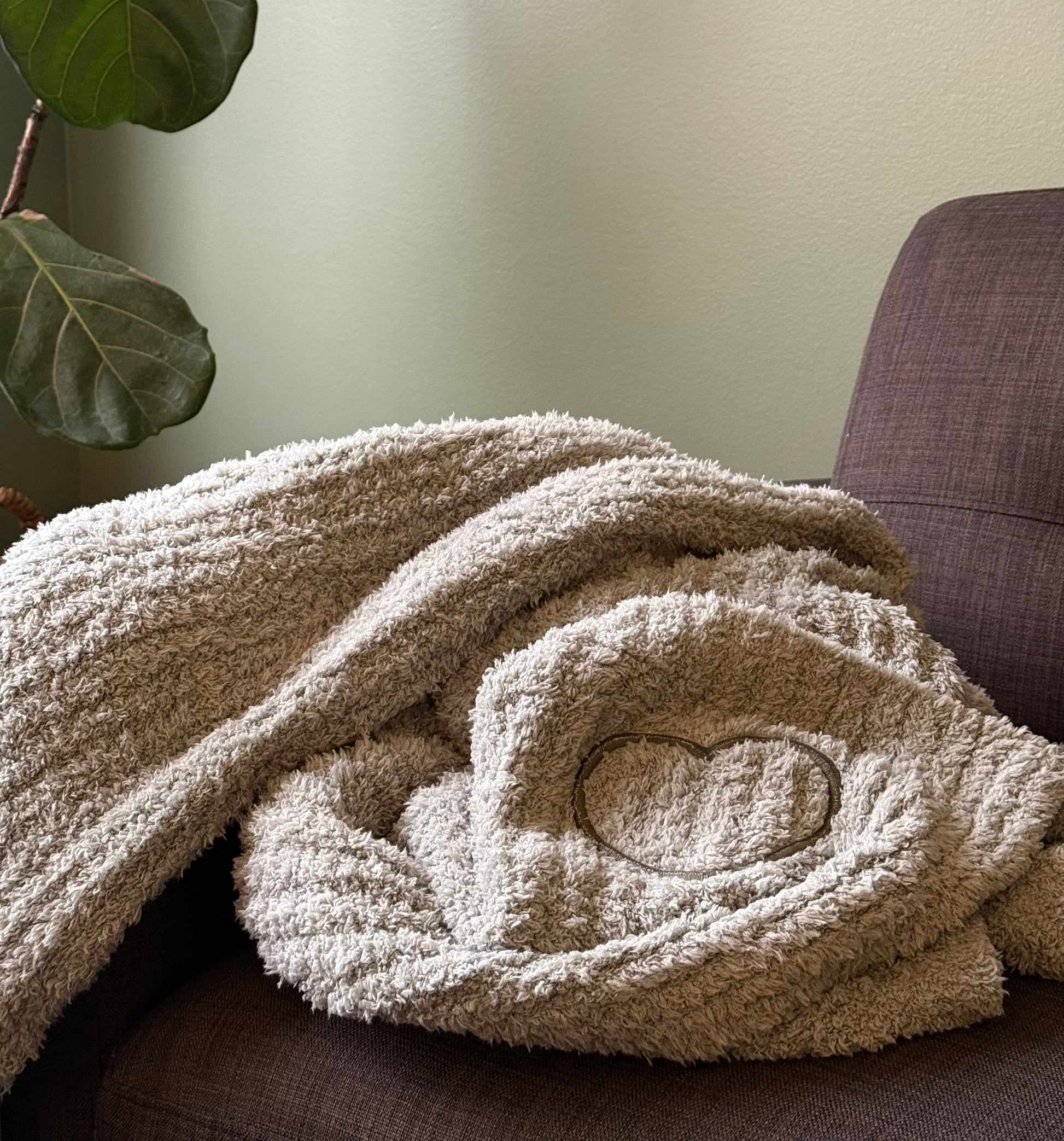 Luxury chenille comfort blanket in Ocean Mist with embroidered heart, beautifully styled as a thoughtful sympathy and thinking-of-you gift.